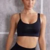 Stretch - Asymmetric Sports Bra In Jet Black